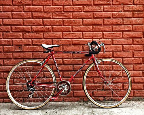 bicycle-bike-leaning-red-bike